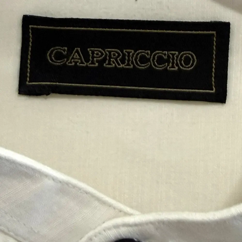 Capriccio men’s L 16-16 1/2. Relaxed and soft casual cream or off-white color